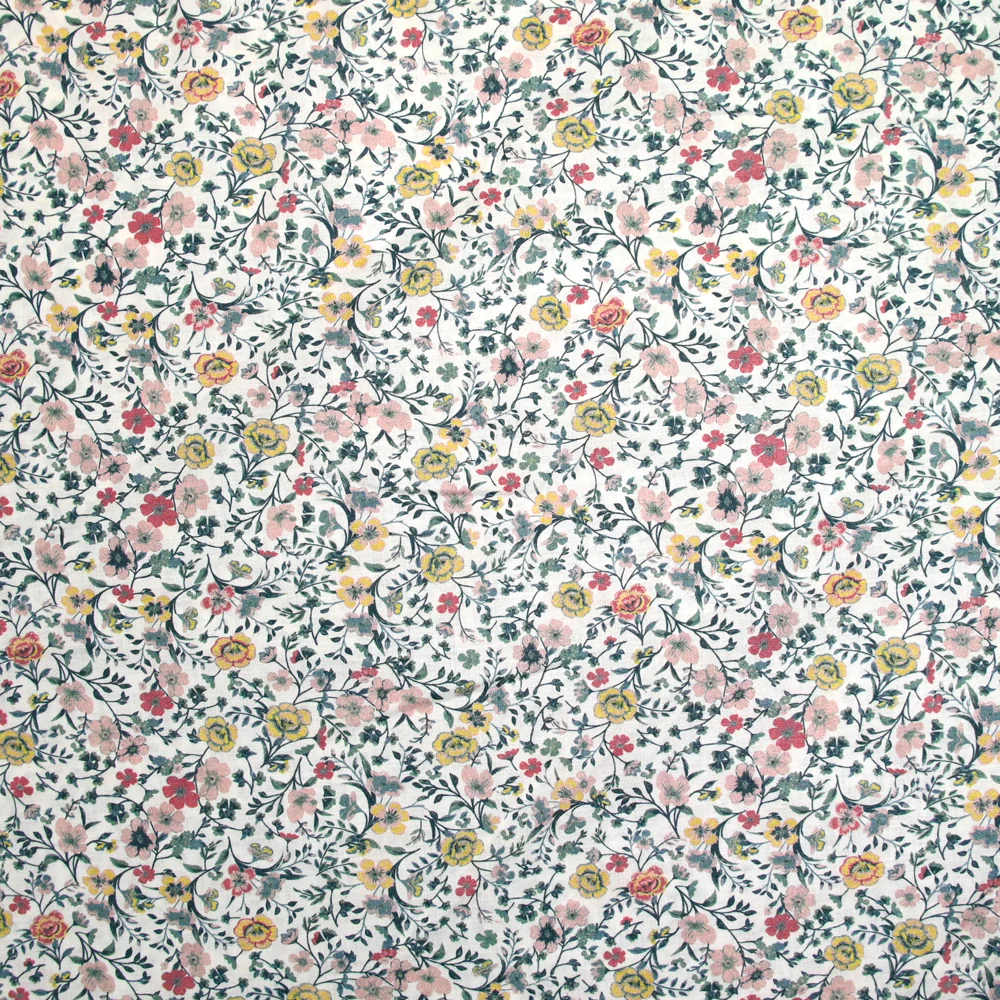Coton imprimé Aurora fleurs rose et jaune fond blanc au mètre