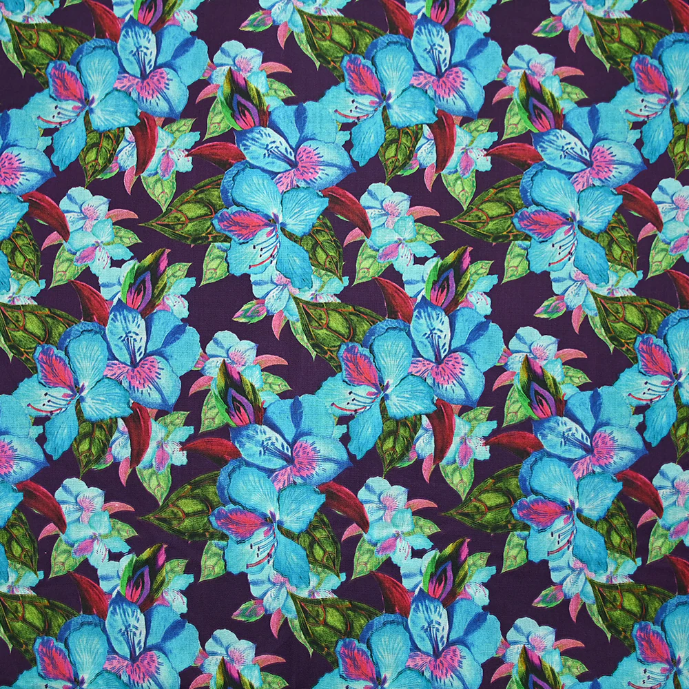 Coton imprimé fleurs exotiques bleu et vert fond violet