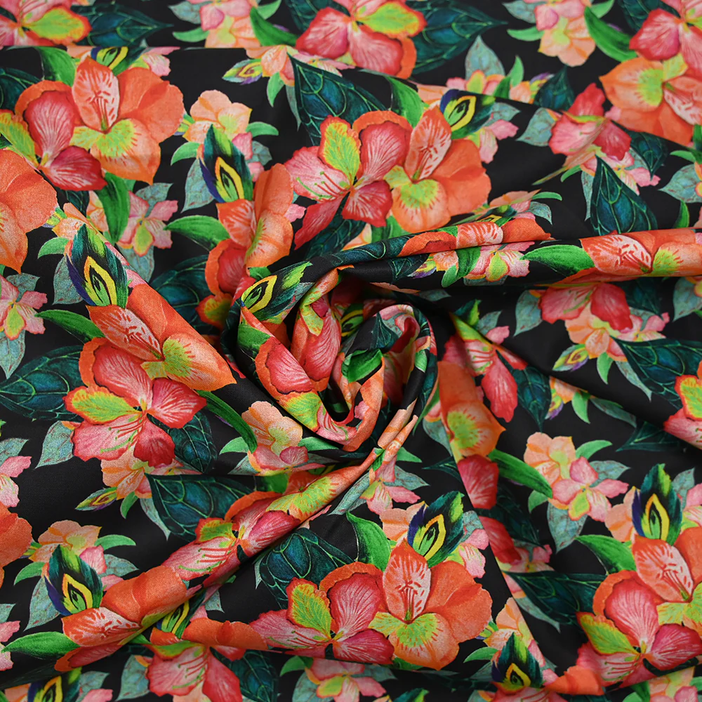 Coton imprimé fleurs exotiques corail et vert fond noir - Image 2