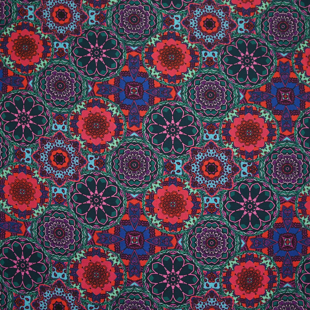 Coton imprimé kaléidoscope floral vert et fuchsia
