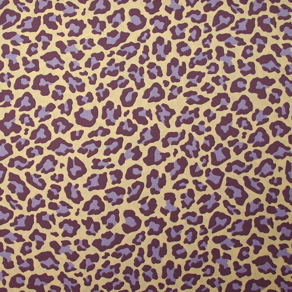 Coton imprimé léopard violet fond jaune beurre