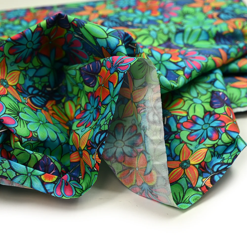 Coton imprimé rayon de soleil vert et bleu néon - Image 4