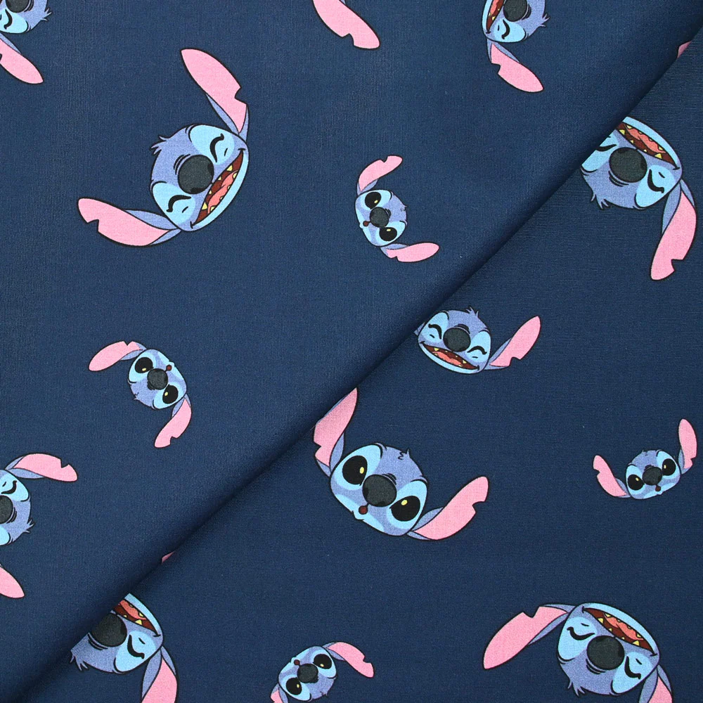 Coton imprimé tête de Stitch fond marine