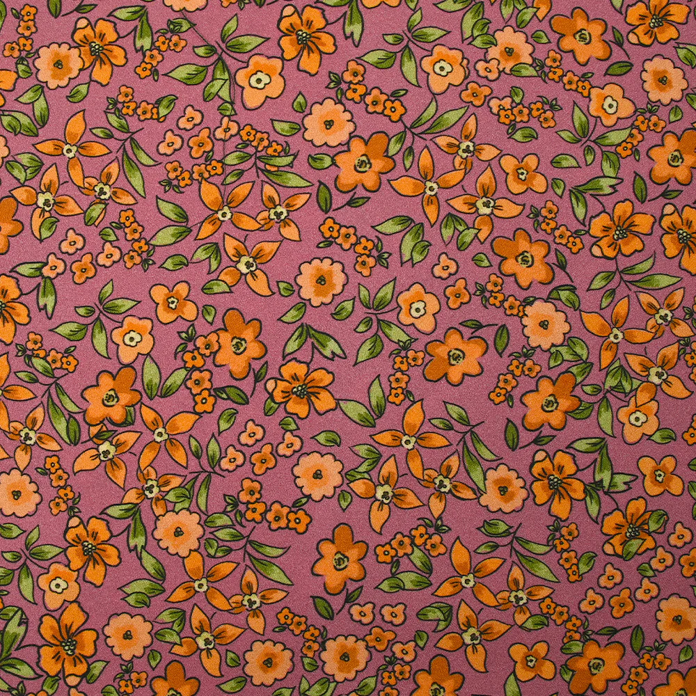 Crêpe viscose imprimé fleurs orange fond cassis glacé