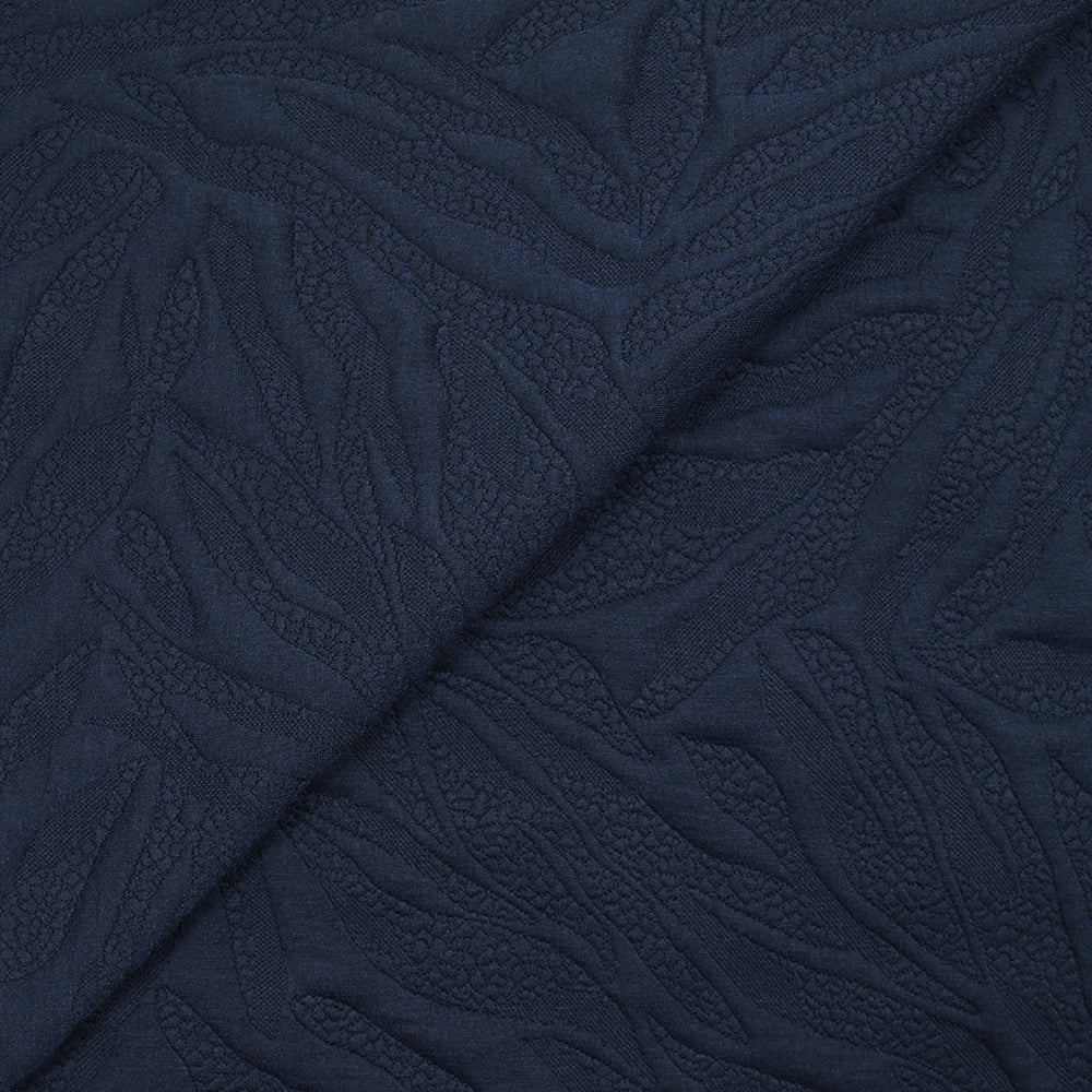 Jersey matelassé fissures fond bleu marine