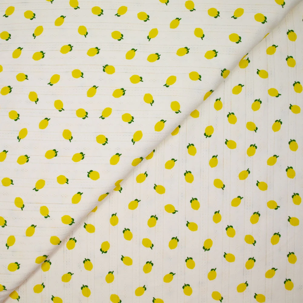 Jersey pointelle coton imprimé citron fond blanc cassé