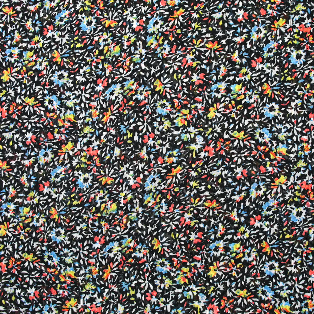 Mousseline crinkle imprimée irisée miette de fleur fond noir