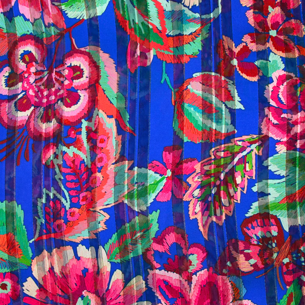 Mousseline imprimée bande satin carnaval de fleurs fond bleu