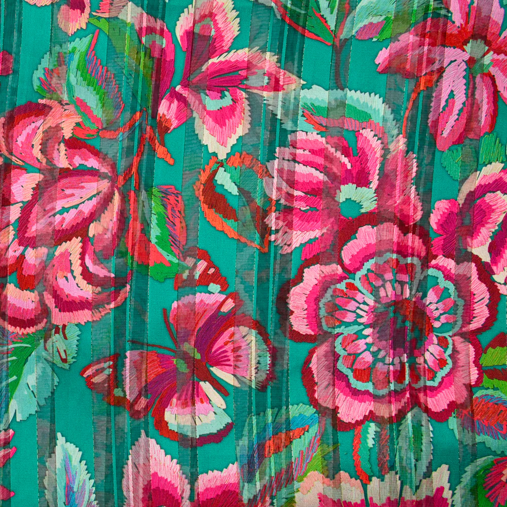 Mousseline imprimée bande satin carnaval de fleurs fond vert