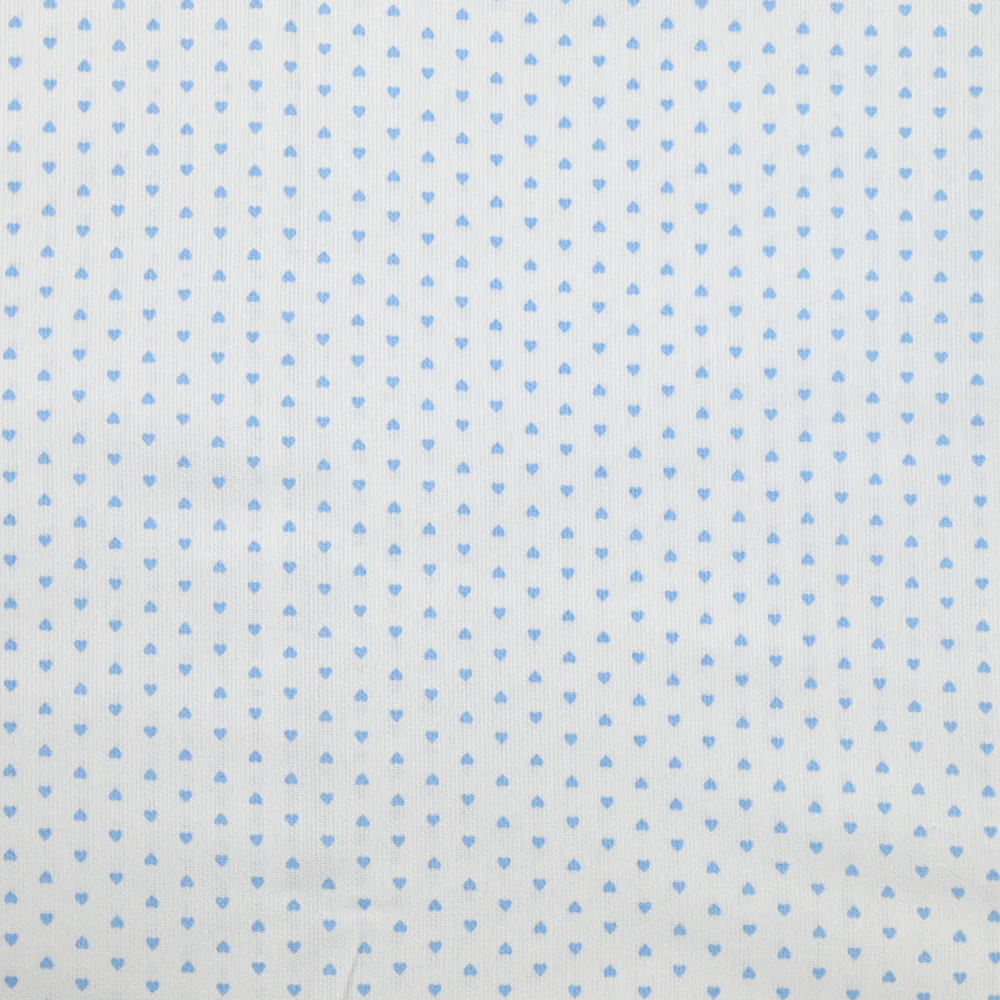 Piqué de coton imprimé coeur bleu fond blanc