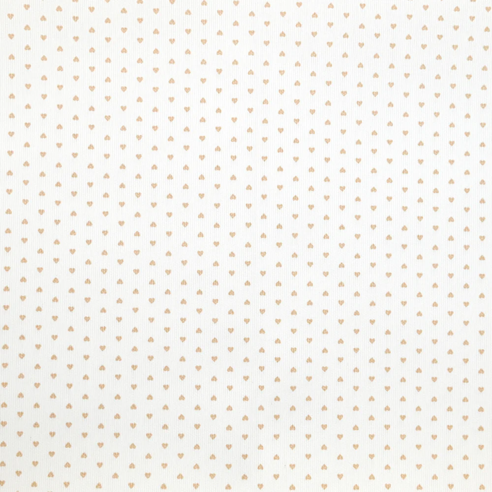 Piqué de coton imprimé coeur camel fond blanc
