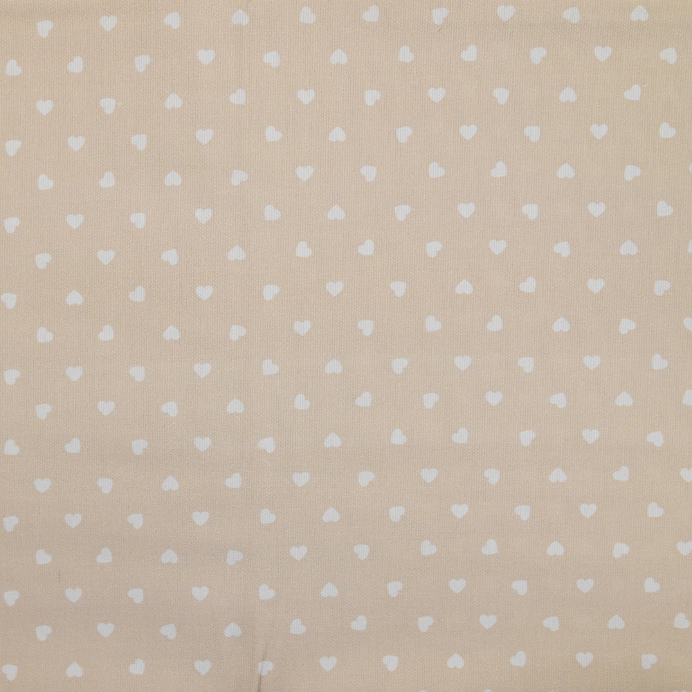 Piqué de coton imprimé cœur fond beige