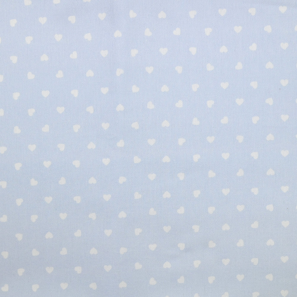 Piqué de coton imprimé cœur fond bleu clair