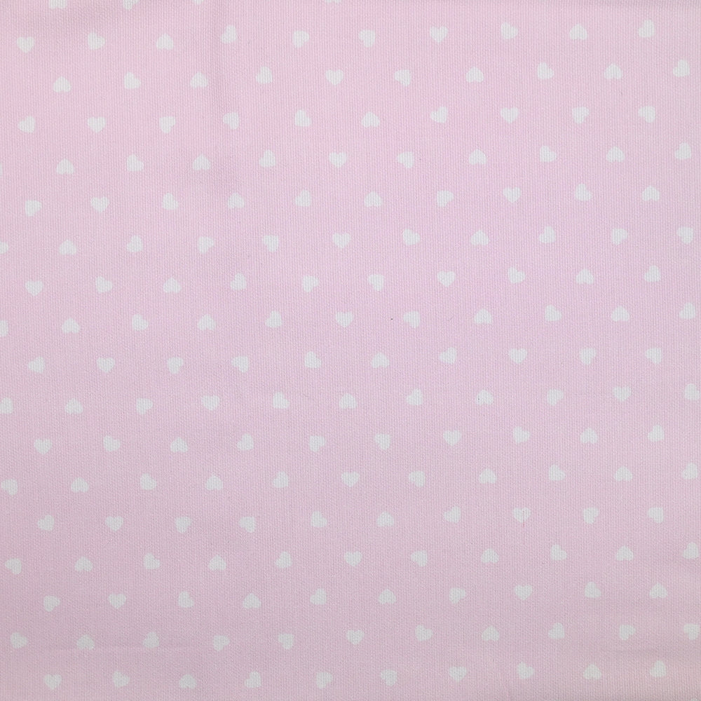 Piqué de coton imprimé cœur fond rose clair