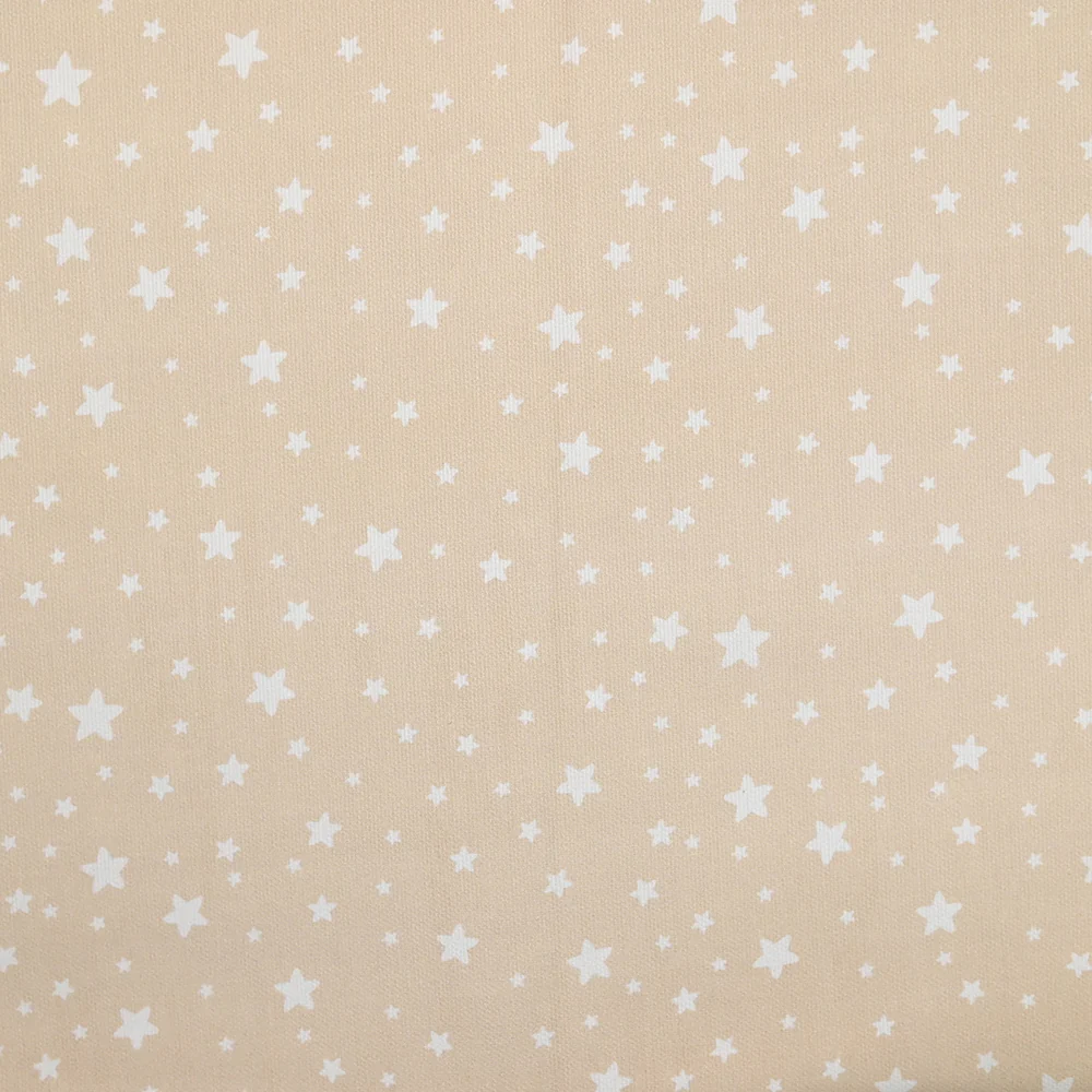 Piqué de coton imprimé étoiles fond beige