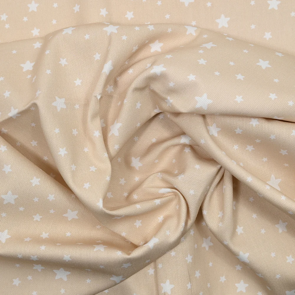 Piqué de coton imprimé étoiles fond beige - Image 2