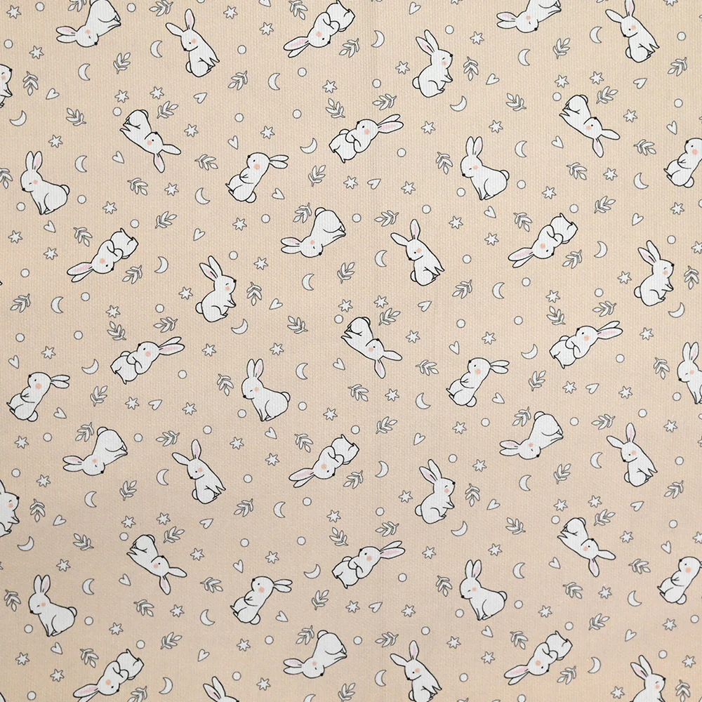 Piqué de coton imprimé jeune lapin fond beige