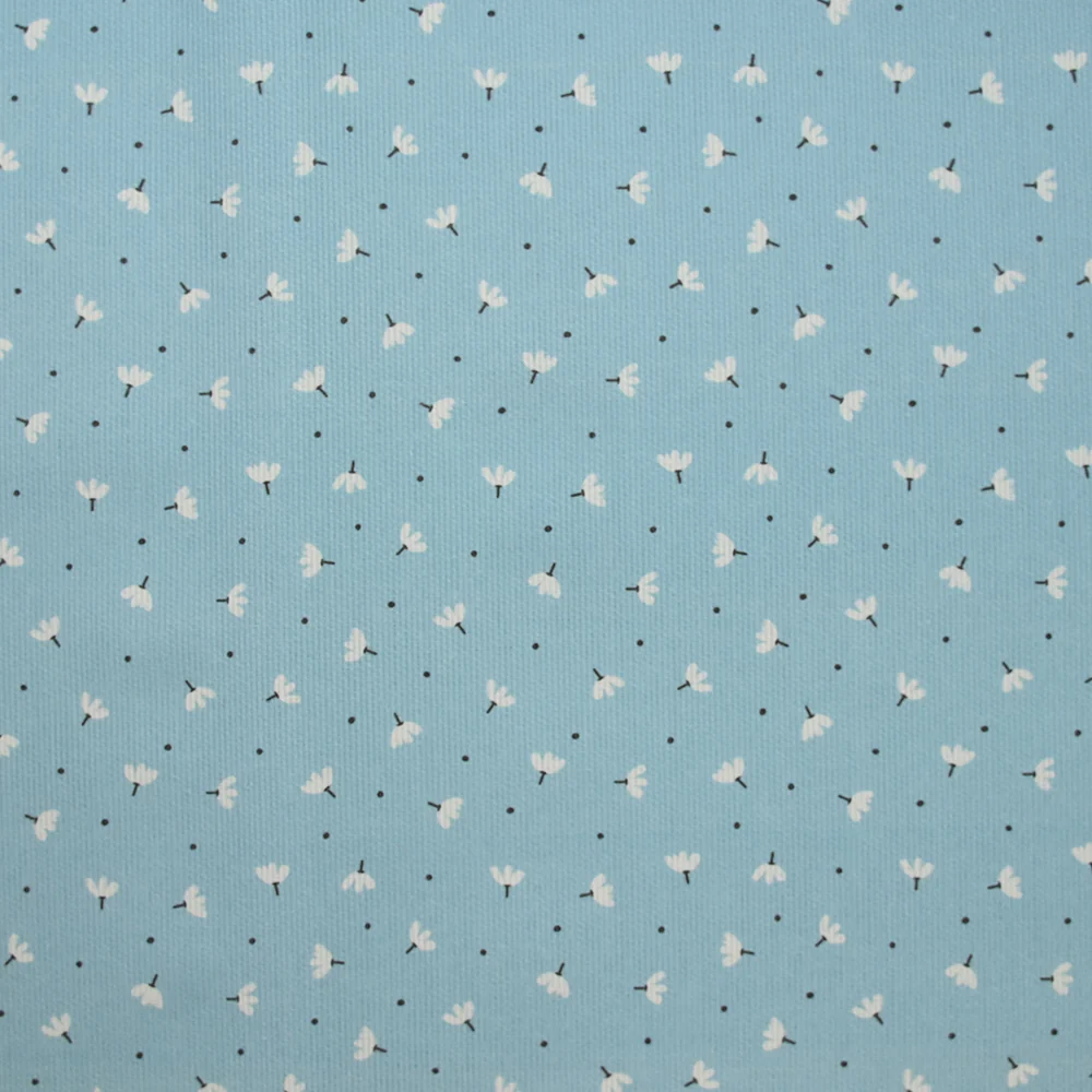 Piqué de coton imprimé pissenlit fond bleu bébé