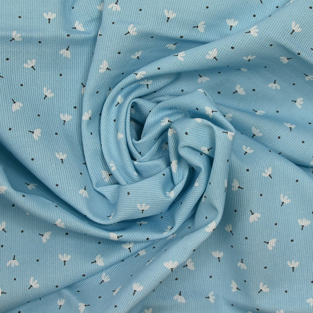 Piqué de coton imprimé pissenlit fond bleu bébé - Image 2