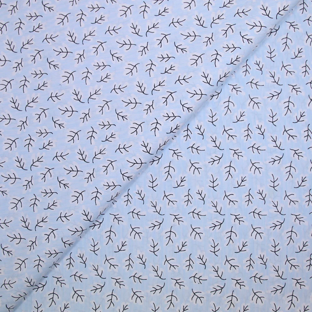 Popeline polycoton imprimée rayée et branche fond bleu