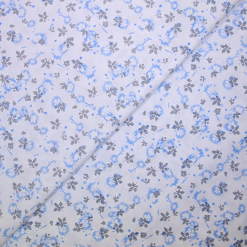 Popeline polycoton imprimée camouflage bleu