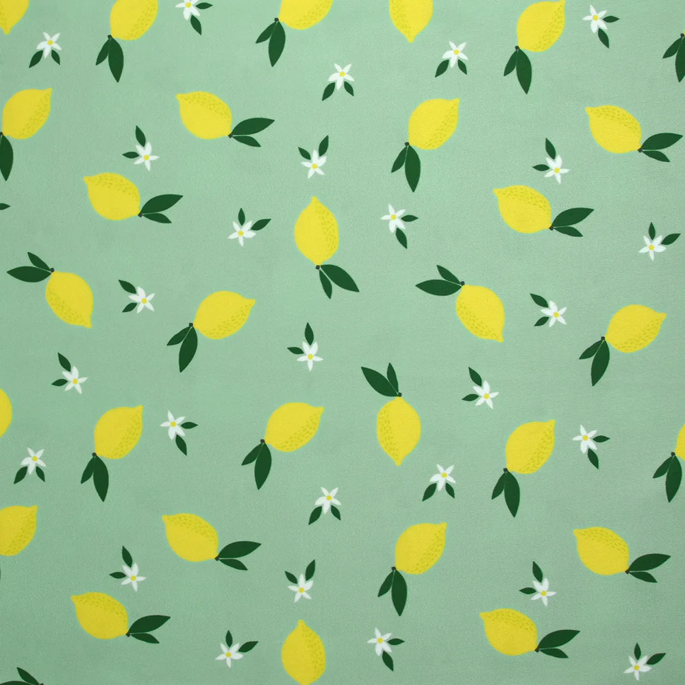 Tissu Maillot de bain recyclé UPF50 citrons et fleurs fond menthe