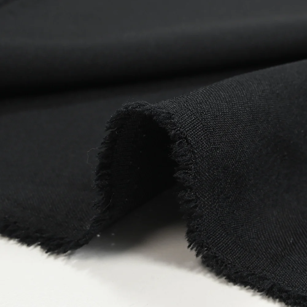 Tissu tailleur laine mélangée souple sergé noir profond - Image 4