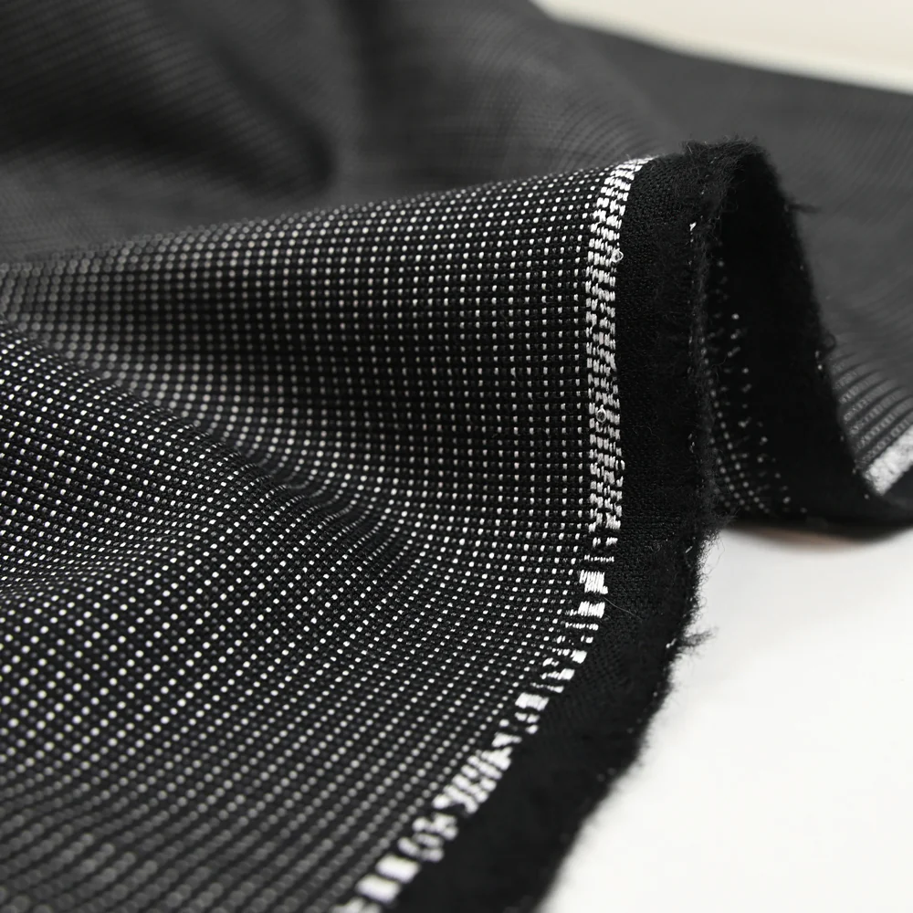 Tissu tailleur lin et laine mélangée pointillé blanc et gris fond noir - Image 5