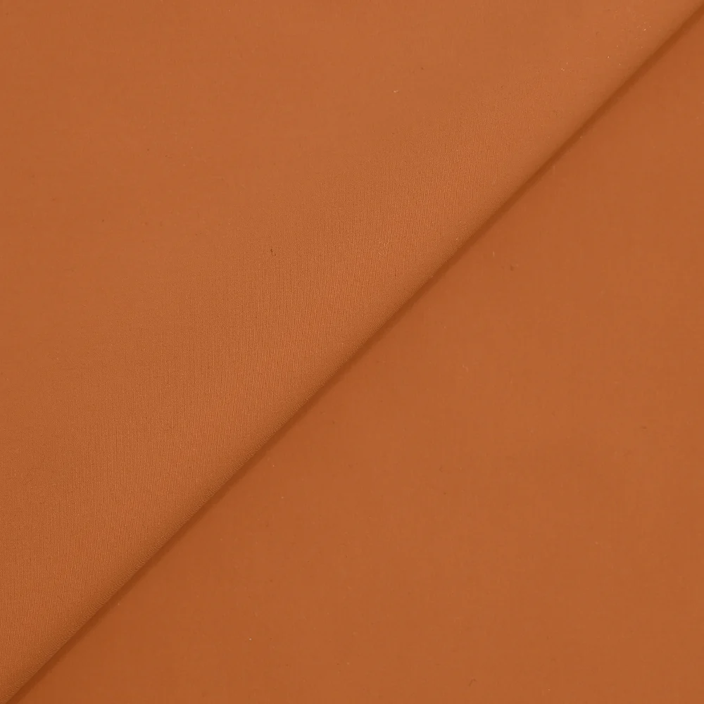 Toile polyester extensible orange brûlé