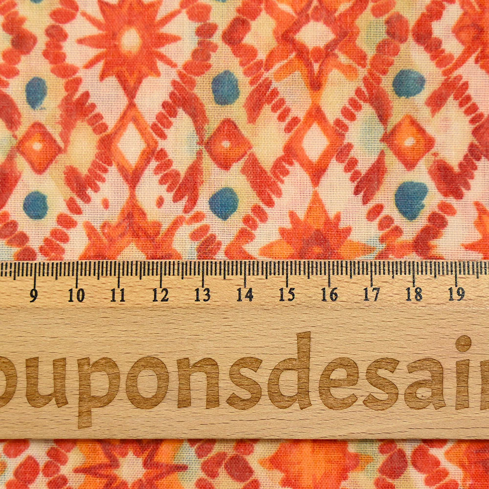 Voile polycoton imprimé diverses étoiles orange fond blanc - Image 3